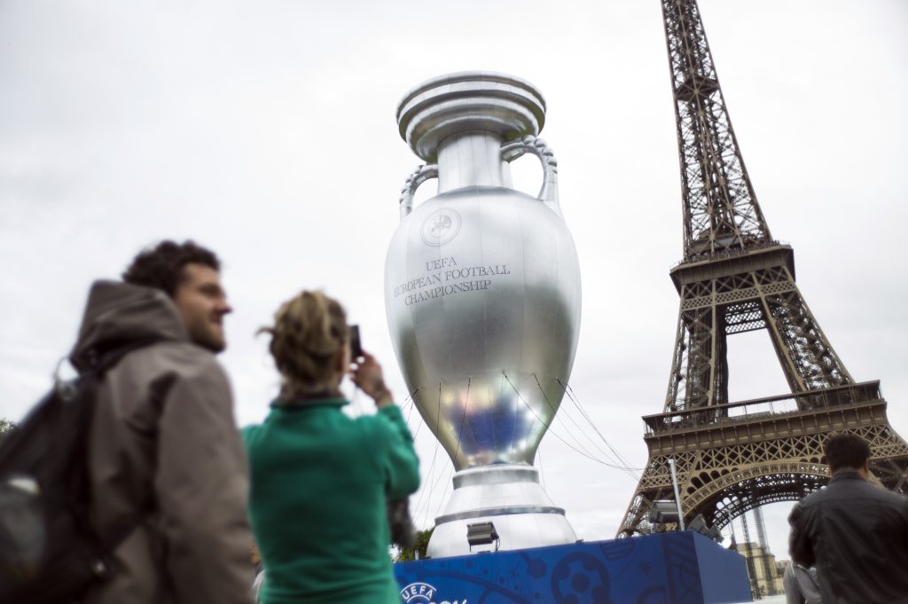 A giant replica of the Henri Delaunay trophy, awarded to the winner of the UEFA European Championship, is displayed near the Eiffel Tower on the Champs de Mars in Paris on June 23, 2013 on the sidelines of the launch of UEFA Euro 2016 brand and logo. AFP PHOTO / FRED DUFOUR (Photo credit should read FRED DUFOUR/AFP/Getty Images)