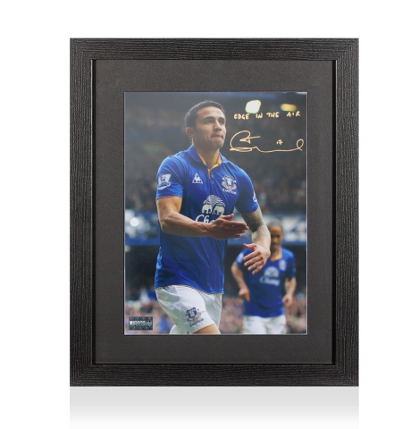 Tim Cahill Signed Everton Photo In Black Wooden Frame: Edge In The Air Inscription