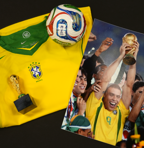 Ronaldo Official FIFA World Cup™ Back Signed and Framed Brazil Home T-Shirt with Fan Style Numbers - Platinum Bundle Ronaldo Official FIFA World Cup™ Back Signed and Framed Brazil Home T-Shirt with Fan Style Numbers - Platinum Bundle